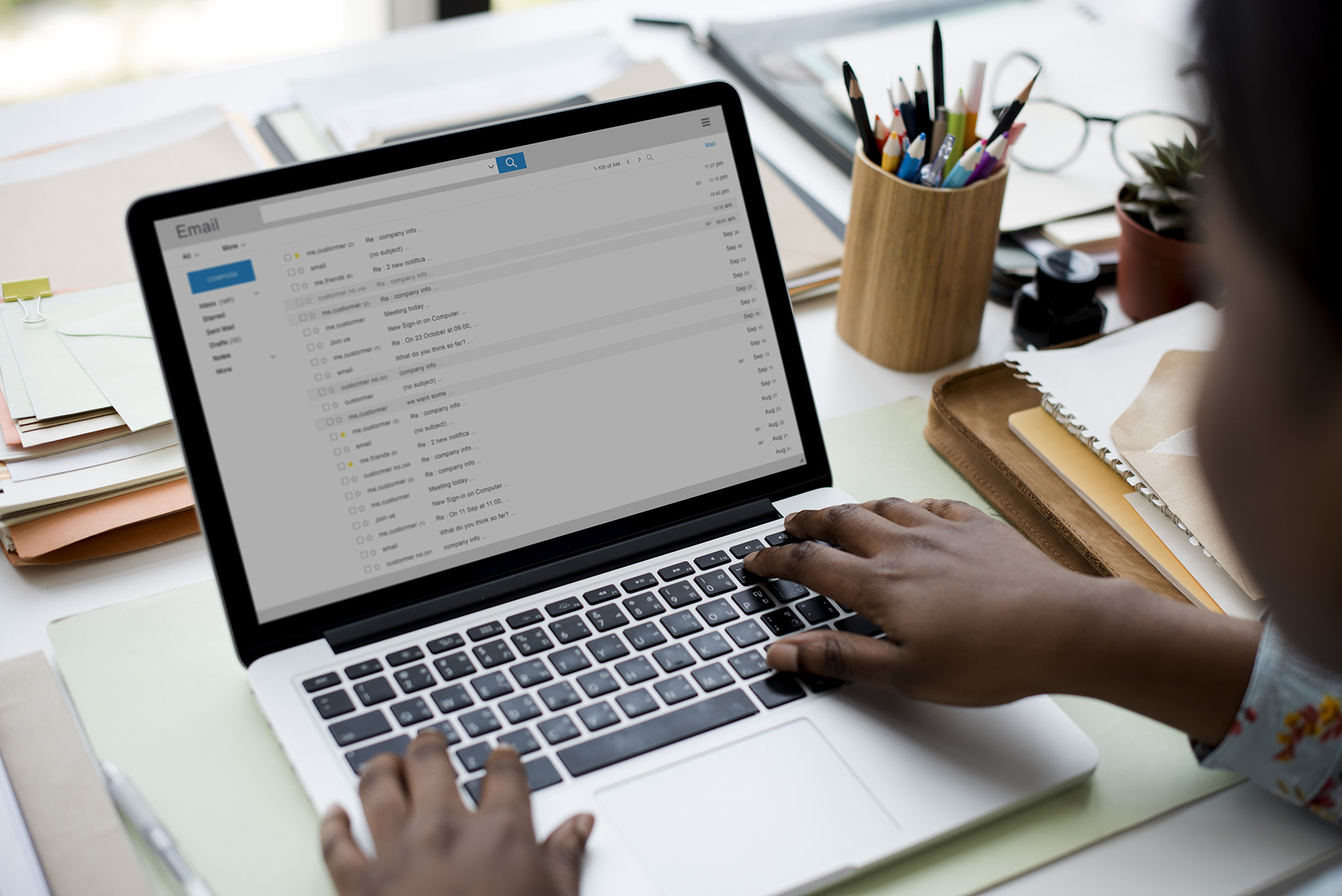 Person checking emails on laptop