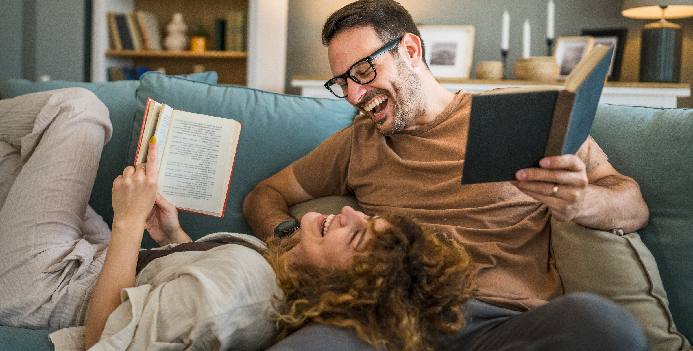 Couple laughing and reading together
